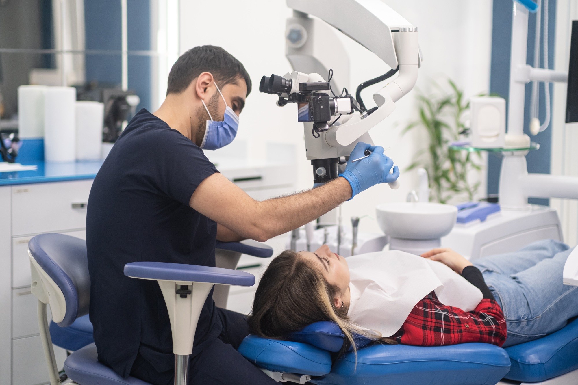 High-quality dentistry services in contemporary clinic dentist checking teeth